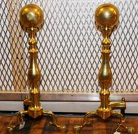 A Pair of American Brass Andirons Height 23 1/2 inches.